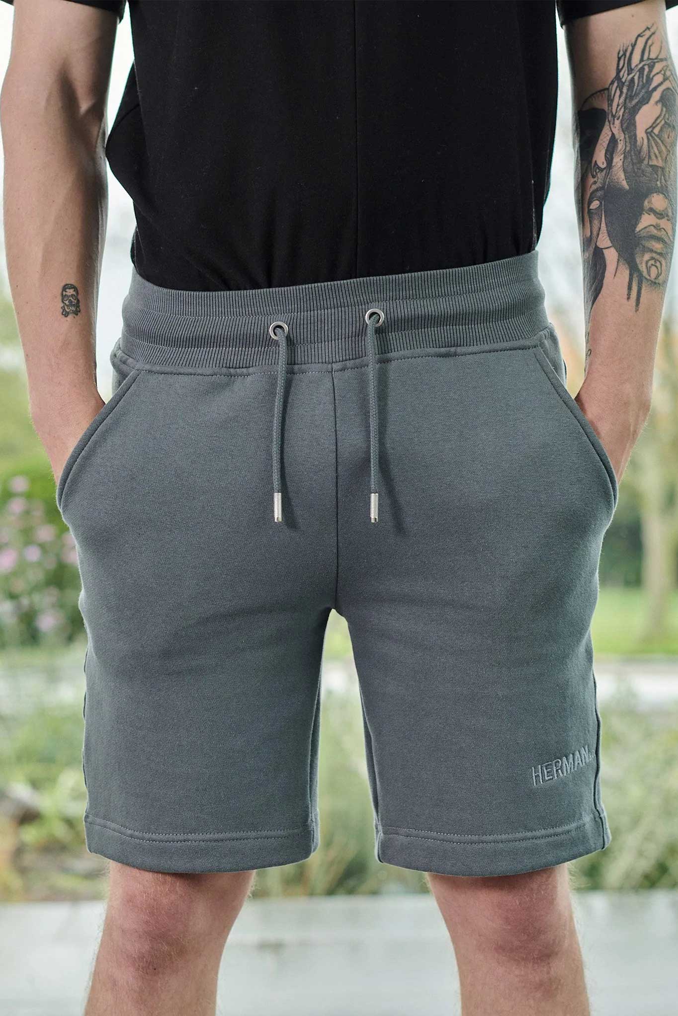 Close up of mens tech fleece shorts grey with drawstring waist and side pockets