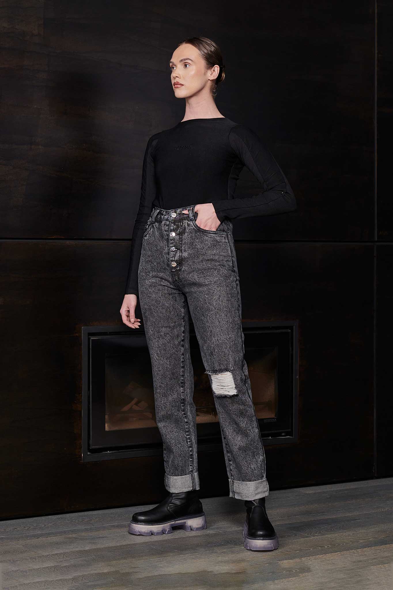 Grey wash acid wash mom jeans laid flat to display shape and details