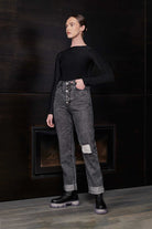 Grey wash acid wash mom jeans laid flat to display shape and details