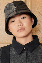 Front view of a model wearing the Herman & Co acid wash bucket hat