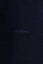 Detailed view of the tonal HERMAN logo embroidery on the chest