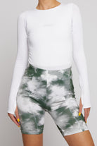 Chest detail of the long-sleeve bodysuit in white.