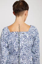 Close-up of the back showing the zip detail on the marble print lace-up top.
