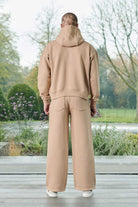 Back view of a model in the men's beige wide-leg joggers