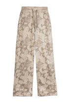 Flat lay front view of essential mens beige tie dye wide leg joggers