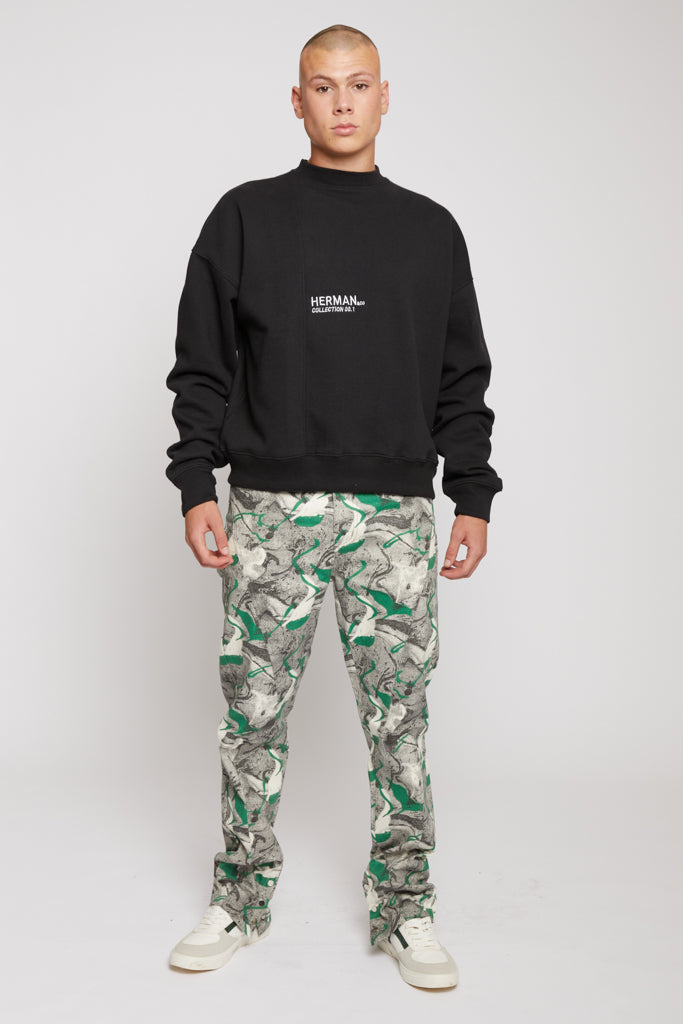 A model wearing the men&#39;s black crew neck jumper with a white front logo.