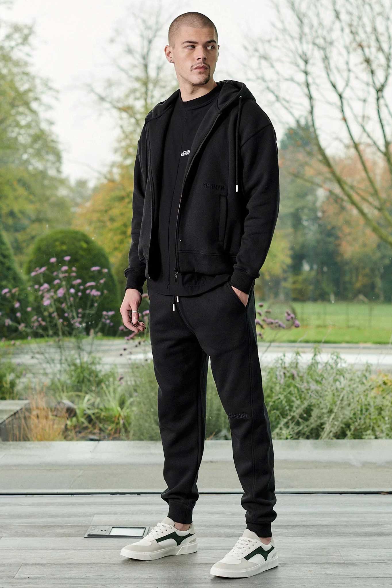 Side profile view showing the casual fit of mens black zip up hoodie