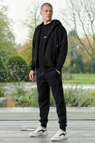 Side profile view showing the casual fit of mens black zip up hoodie
