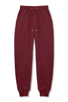 Front view of the men's dark red tapered joggers laid flat.