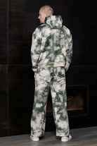 Rear view of relaxed fit mens green tie dye hoodie and joggers set