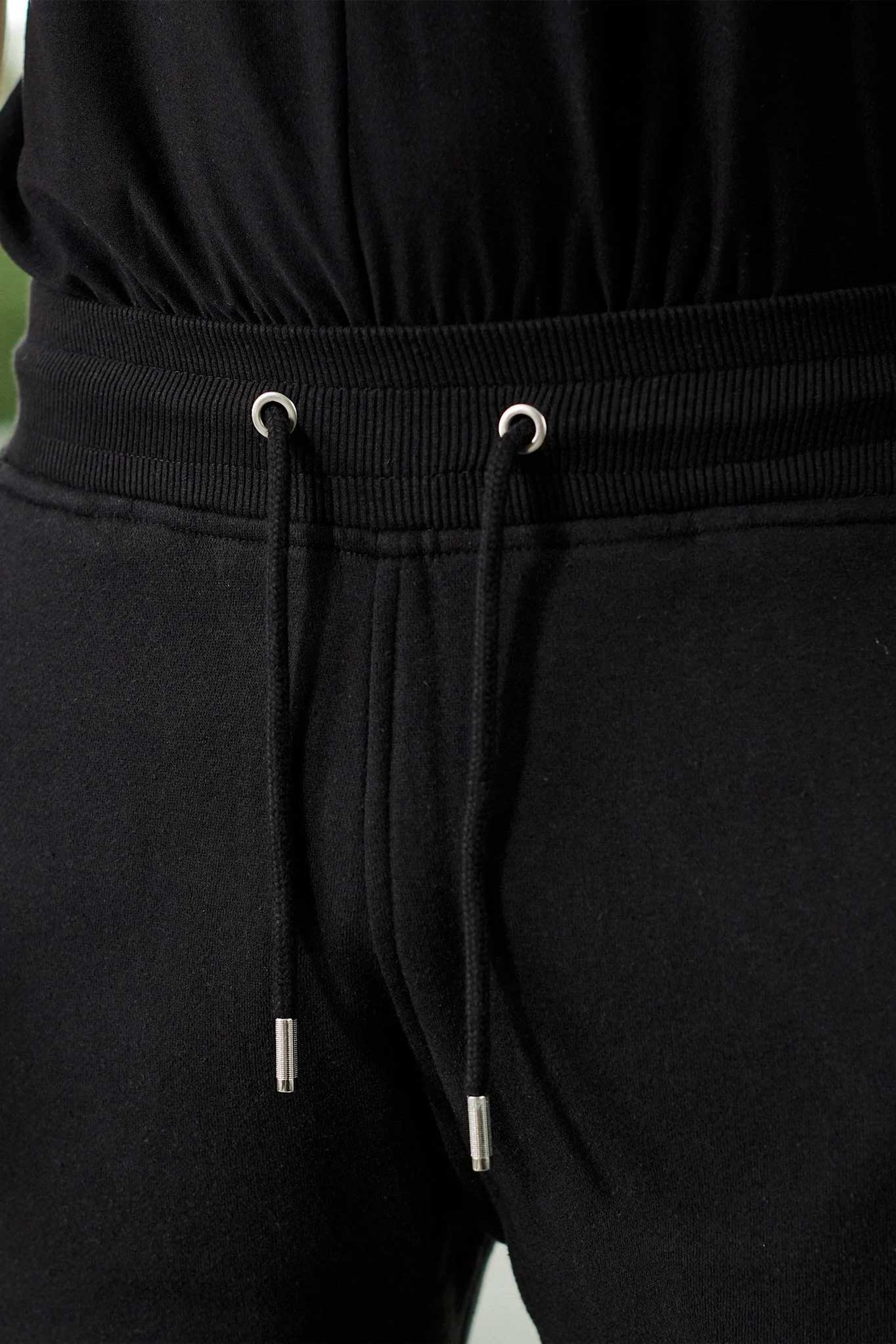 Close-up of the drawstring waistband on the men's tapered joggers