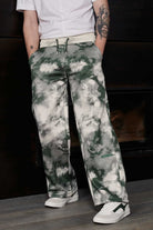 Close-up of the men's dark green and white tie-dye wide-leg joggers.