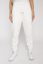 Front view of the men's white tapered joggers showing the tapered fit.