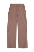 Front view of the men's wide-leg joggers in brown laid flat.