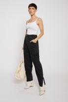 A model styled with the oversized ecru tote bag for a complete look