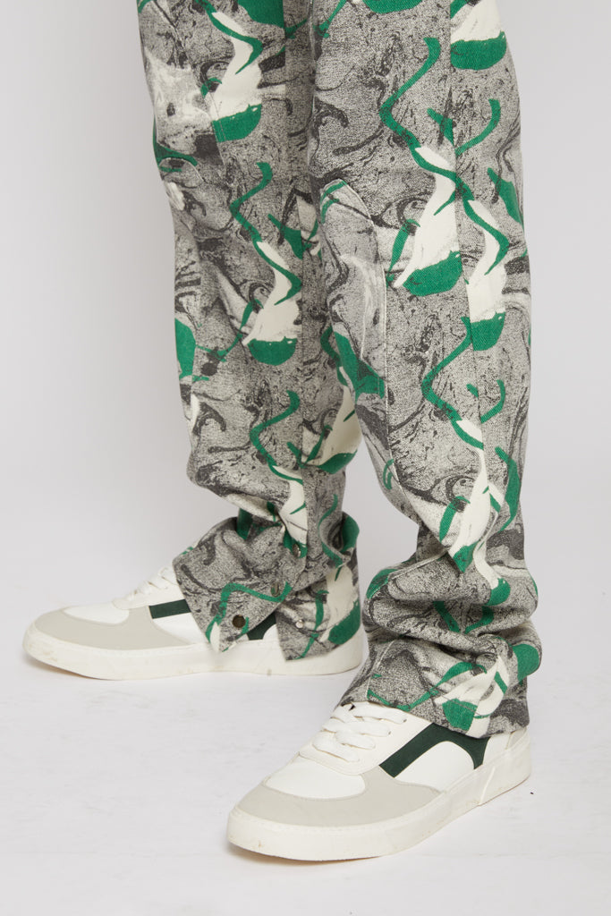 Close-up of the hem and print detail on the men's denim jeans.