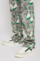 Close-up of the hem and print detail on the men's denim jeans.