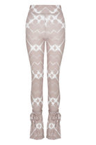 Back view of the printed flare leggings laid flat.