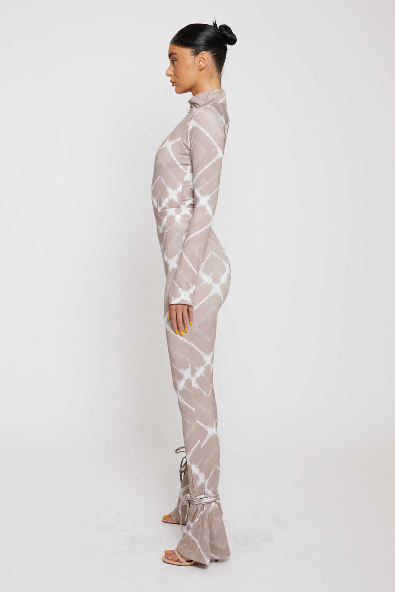 Side profile of a model showing the fit of the printed flare leggings.
