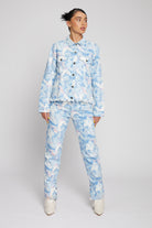 A model styled in the full psychedelic marble print denim jacket and matching jeans.