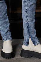 Detailed view of the zip opening at the ankle of the skinny jeans