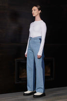 A model styled in the half wash two-tone baggy jeans.