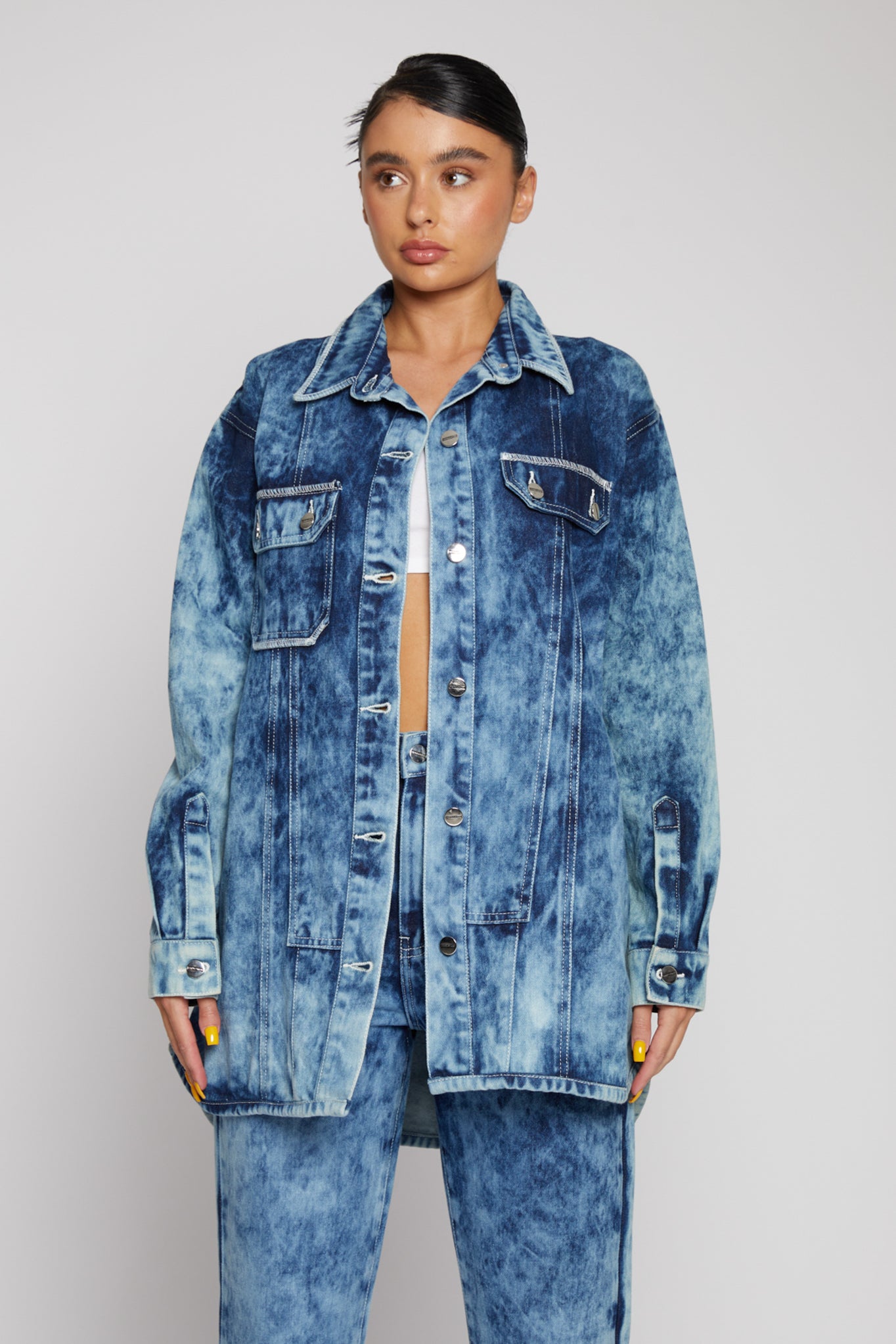 A model showing how to style the bleach wash seam detail shirt.