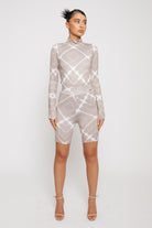 Full view of a model wearing the taupe printed cycling shorts co-ord set.