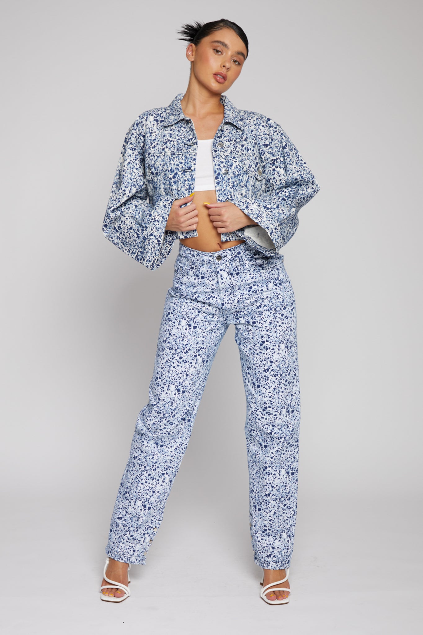 Full view of a model in the wide sleeve marble denim jacket and co-ord jeans.