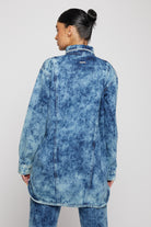 Close-up of the back of the women's bleach wash shirt.