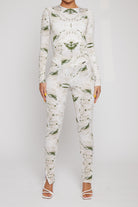 A model wearing the women's printed dipped leggings with the matching top.