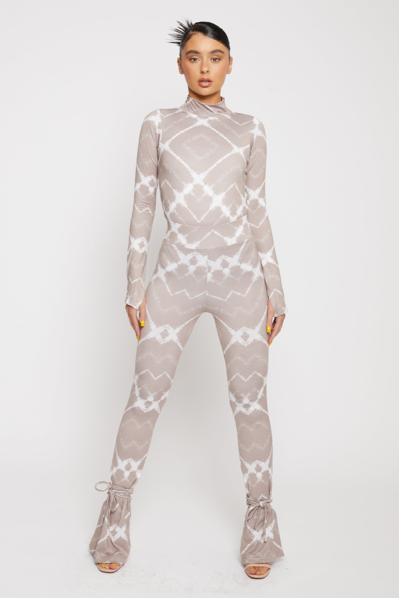 Full front view of the women's taupe printed flare leggings outfit.