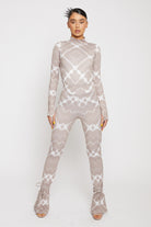Full front view of the women's taupe printed flare leggings outfit.